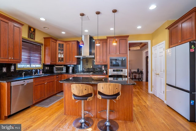 10 Eddie Ct, Dayton, NJ 08810 - kitchen featuring tasteful backsplash, wall chimney exhaust hood, stainless steel appliances, and a sink