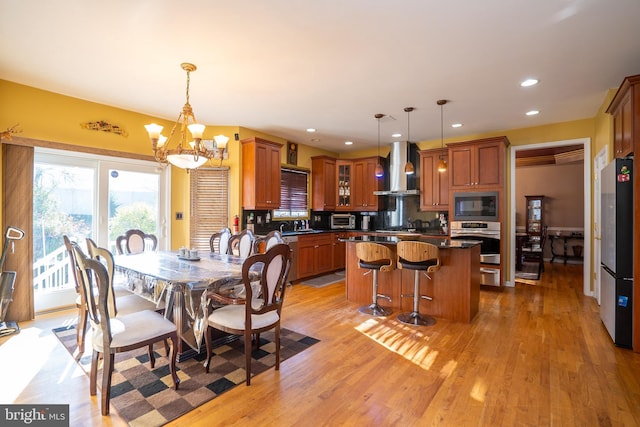 10 Eddie Ct, Dayton, NJ 08810 - dining space featuring recessed lighting, an inviting chandelier, a toaster, and light wood-type flooring
