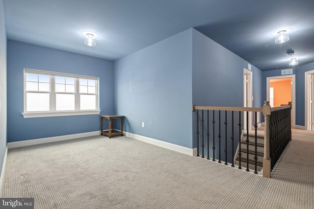 empty room featuring carpet floors