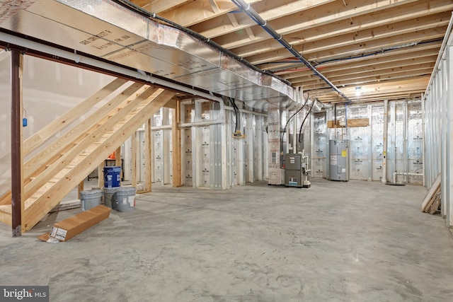 basement with electric water heater and heating unit