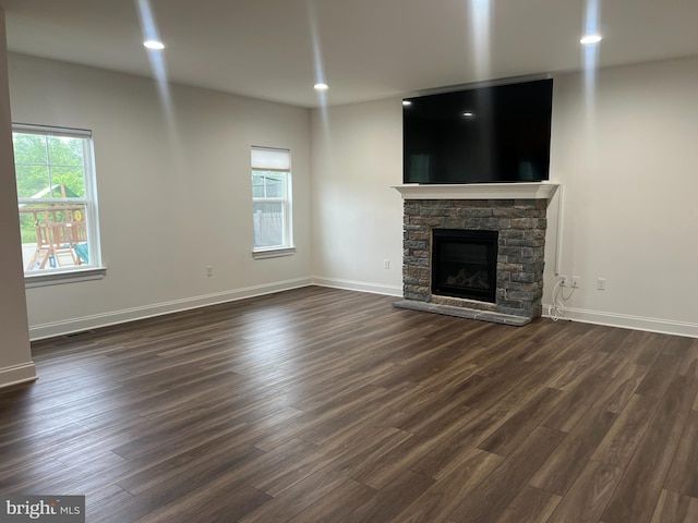 106 Berkshire Dr, Carlisle, PA 17015 - unfurnished living room featuring healthy amount of natural light, dark wood finished floors, and a fireplace