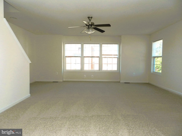 carpeted empty room with ceiling fan