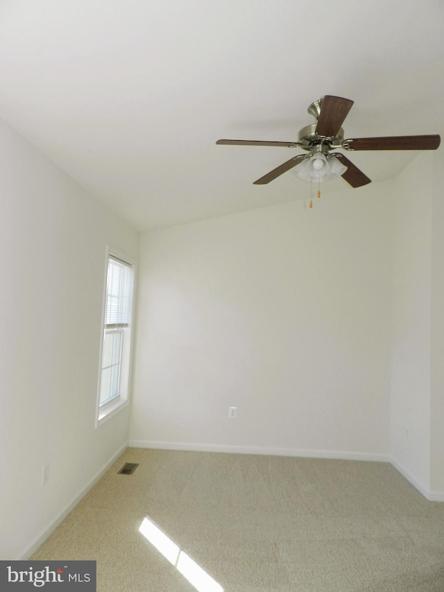 empty room featuring light carpet and ceiling fan