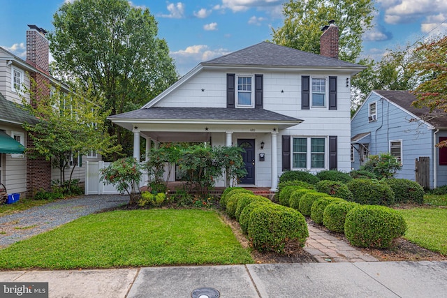 view of front of home featuring a front lawn and covered porch