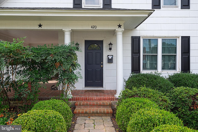 property entrance with covered porch