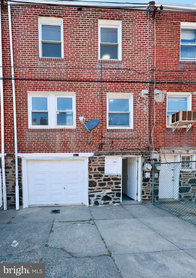 back of house with a garage