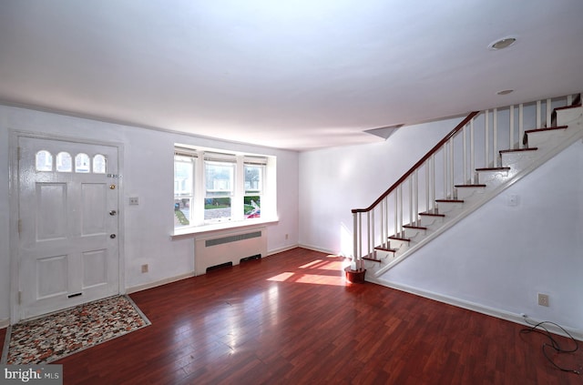 entryway featuring radiator heating unit and hardwood / wood-style flooring