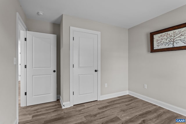 unfurnished bedroom featuring light wood-type flooring