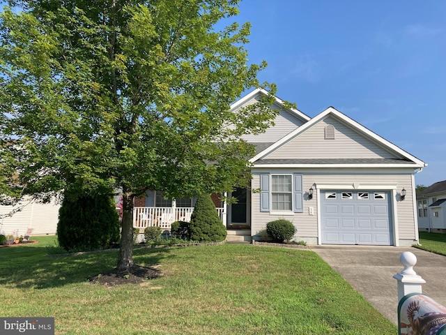 view of front of house featuring a garage and a front lawn