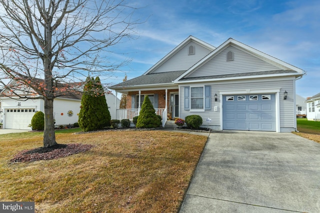 view of front facade featuring covered porch, a garage, and a front lawn