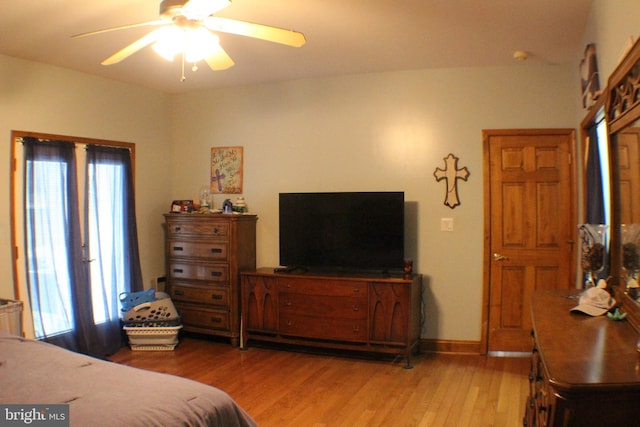 bedroom featuring hardwood / wood-style floors and ceiling fan