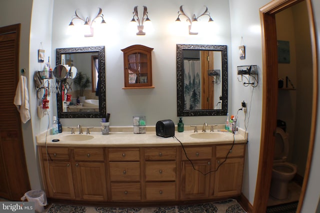 bathroom with vanity and toilet