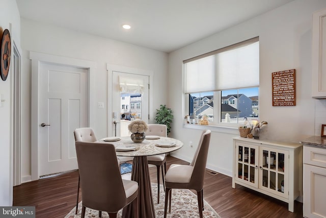 dining room featuring dark wood-type flooring