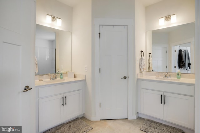 bathroom featuring vanity and tile patterned flooring