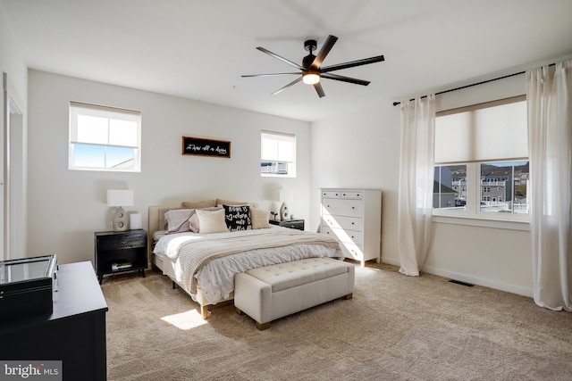 carpeted bedroom featuring ceiling fan