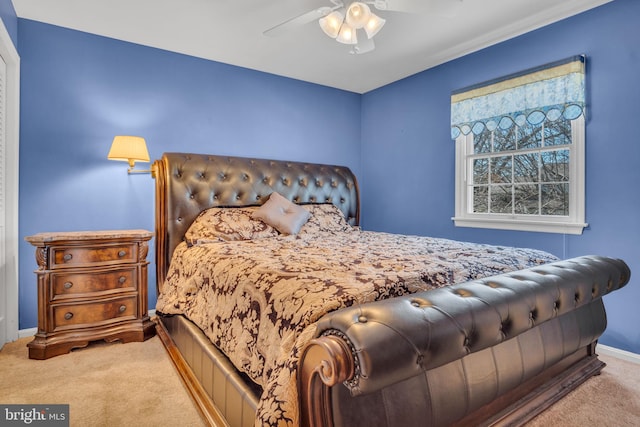 carpeted bedroom featuring ceiling fan