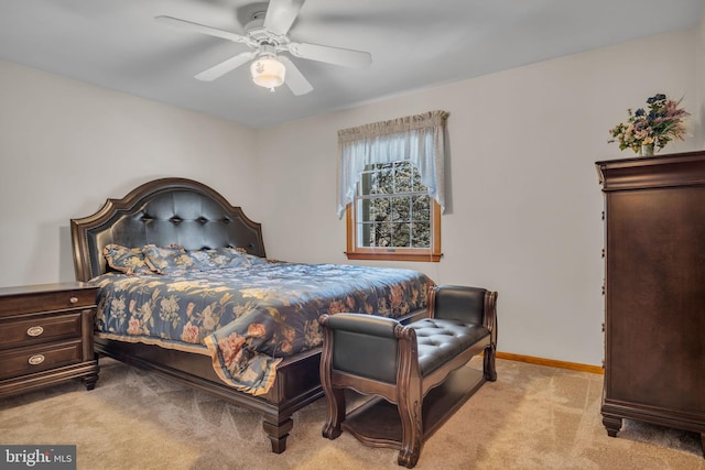 bedroom with ceiling fan and light colored carpet