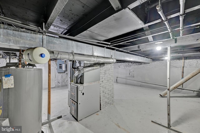 basement with gas water heater, electric panel, and heating unit