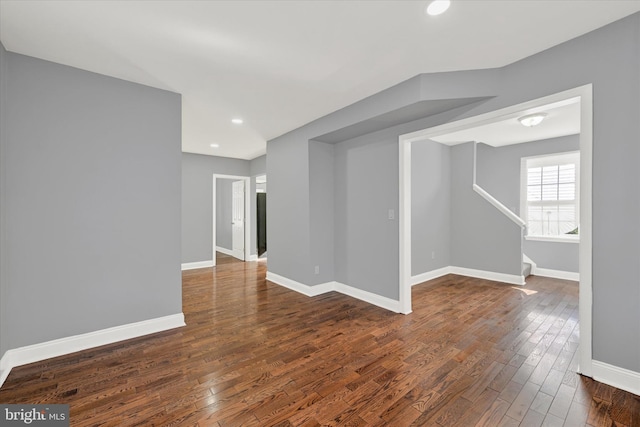 unfurnished room featuring dark hardwood / wood-style flooring