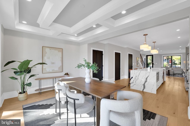 dining space featuring crown molding, baseboards, light wood-type flooring, and recessed lighting