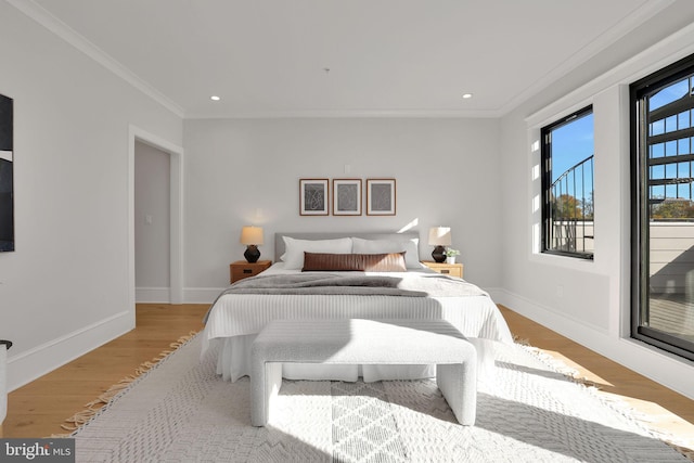 bedroom featuring baseboards, recessed lighting, ornamental molding, and light wood-type flooring