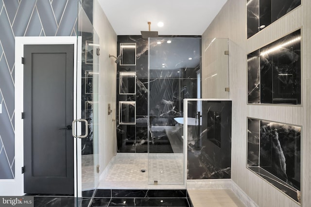 bathroom featuring a marble finish shower and marble finish floor