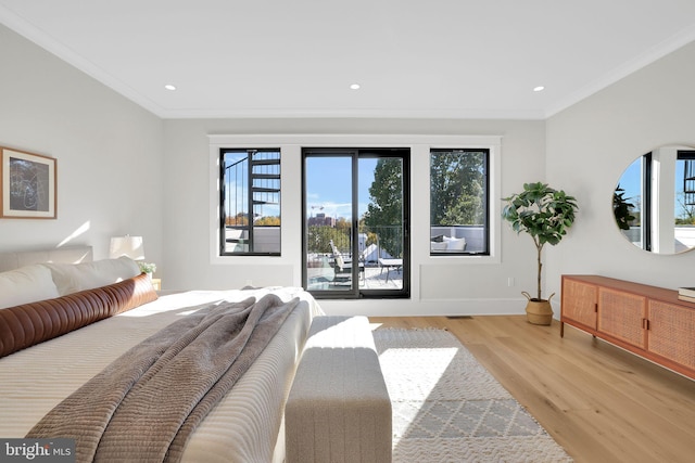 bedroom featuring ornamental molding, light wood-style floors, recessed lighting, and baseboards
