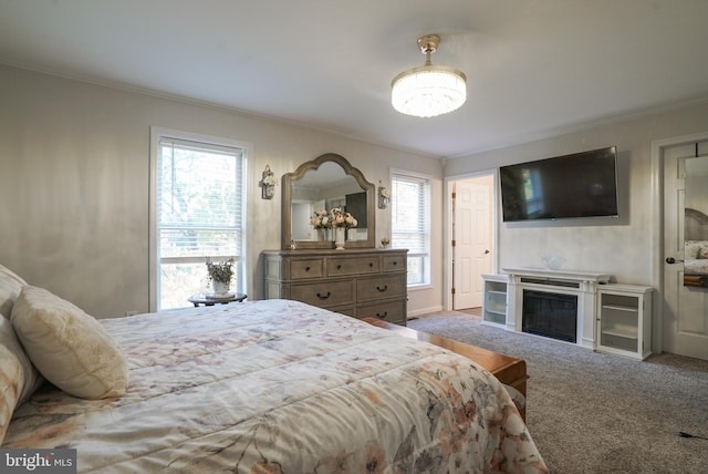 carpeted bedroom featuring ornamental molding