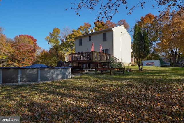 view of yard with a pool side deck