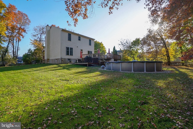 view of yard featuring a swimming pool side deck