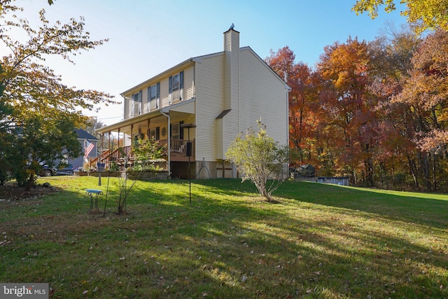 exterior space featuring a yard and a porch