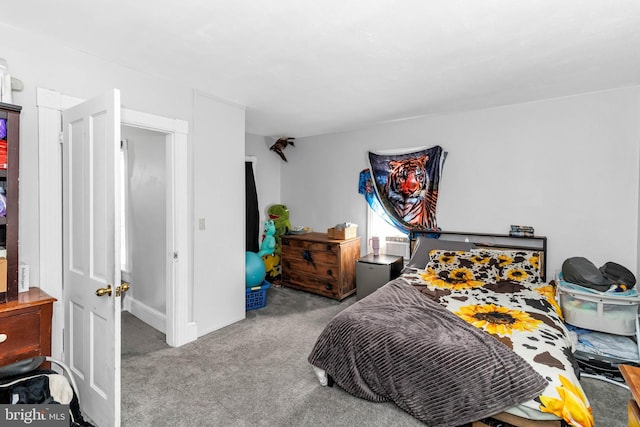 bedroom with light colored carpet