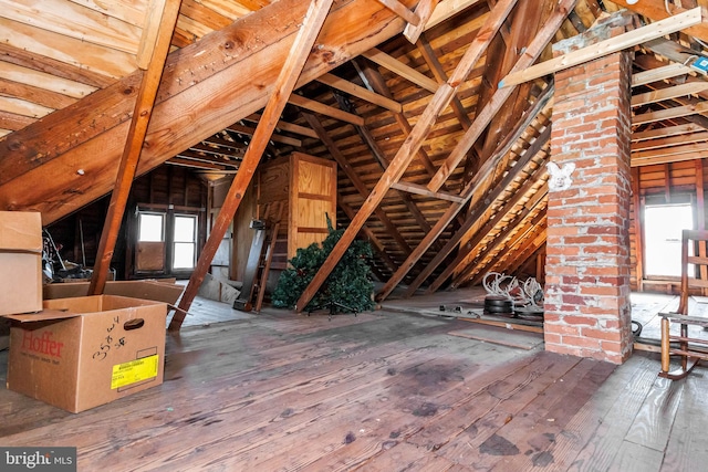 attic featuring plenty of natural light