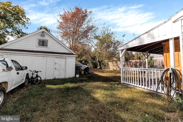 view of property exterior with a deck and a yard