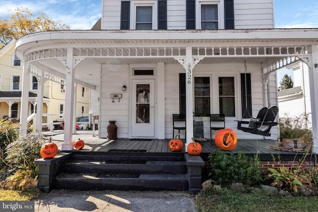 property entrance featuring covered porch