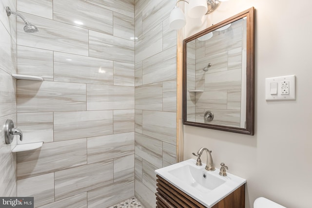 bathroom featuring vanity and a tile shower