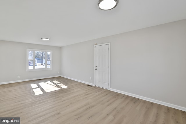 unfurnished room featuring light wood-type flooring