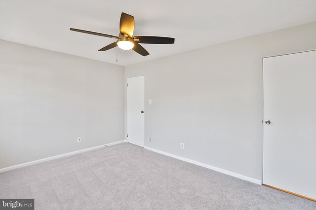 empty room with light carpet and ceiling fan