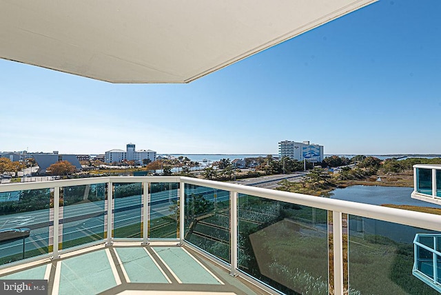 balcony featuring a water view