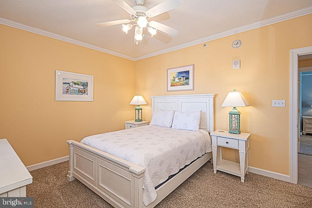 carpeted bedroom with ornamental molding and ceiling fan