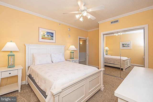 bedroom with a closet, ornamental molding, light colored carpet, a textured ceiling, and ceiling fan