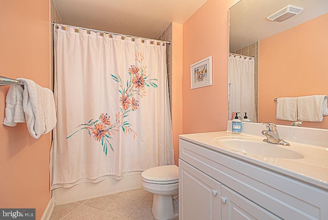 full bathroom featuring vanity, shower / bath combination with curtain, toilet, and tile patterned floors