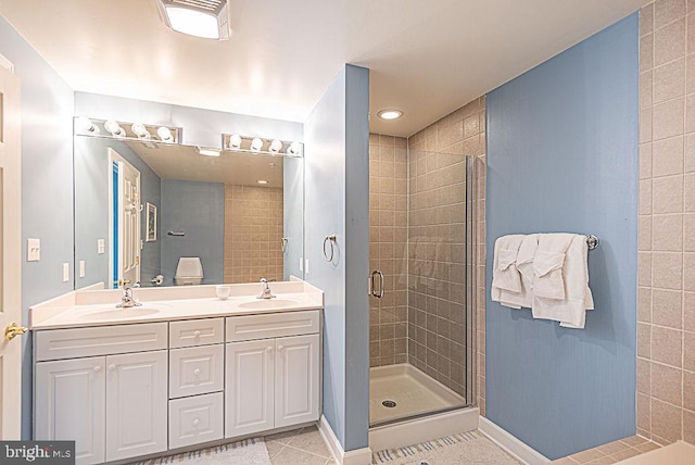 bathroom with vanity, tile patterned floors, and an enclosed shower