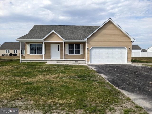 view of front of property featuring a garage, a front yard, and a porch