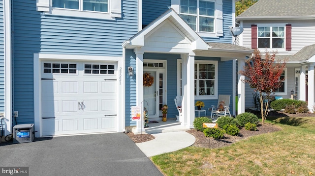 view of exterior entry featuring a garage