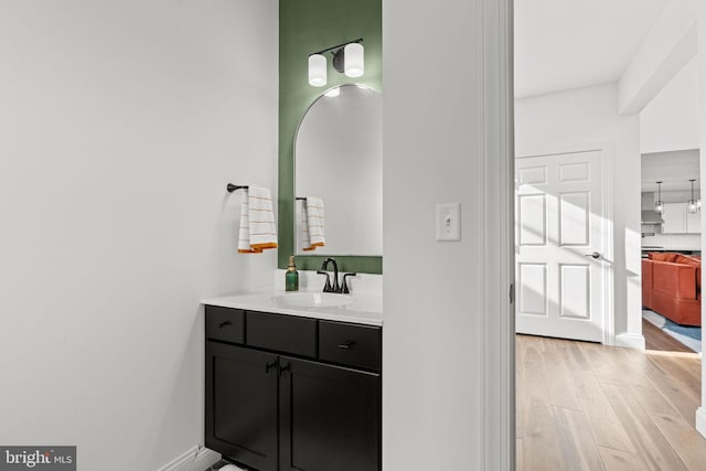 bathroom featuring vanity and wood-type flooring