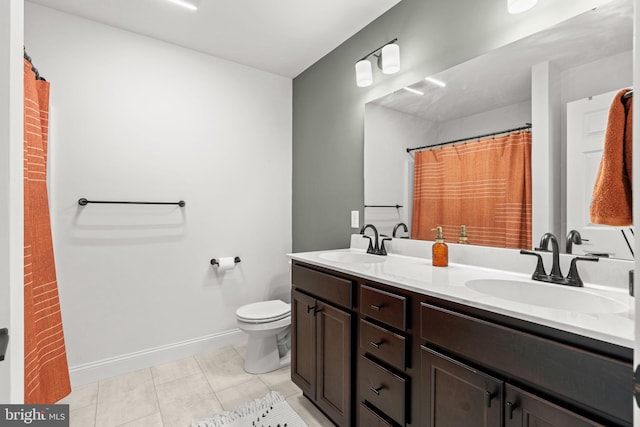 bathroom featuring vanity, toilet, and tile patterned flooring