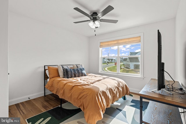 bedroom featuring ceiling fan and hardwood / wood-style flooring