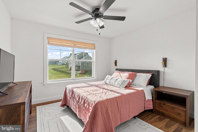 bedroom featuring dark hardwood / wood-style floors and ceiling fan