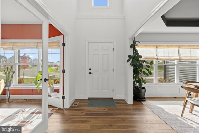 entryway with dark hardwood / wood-style flooring